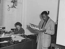 Gordon Parks, photographer, at the Office of War Information during World War II. Photo, around 1943.