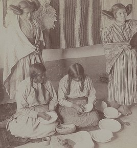 Hopi women decorating pottery. Stereo photograph by Underwood & Underwood, 1903.