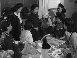 Fashion designing class, Manzanar Relocation Center, California. Photograph by Ansel Adams, around 1943.